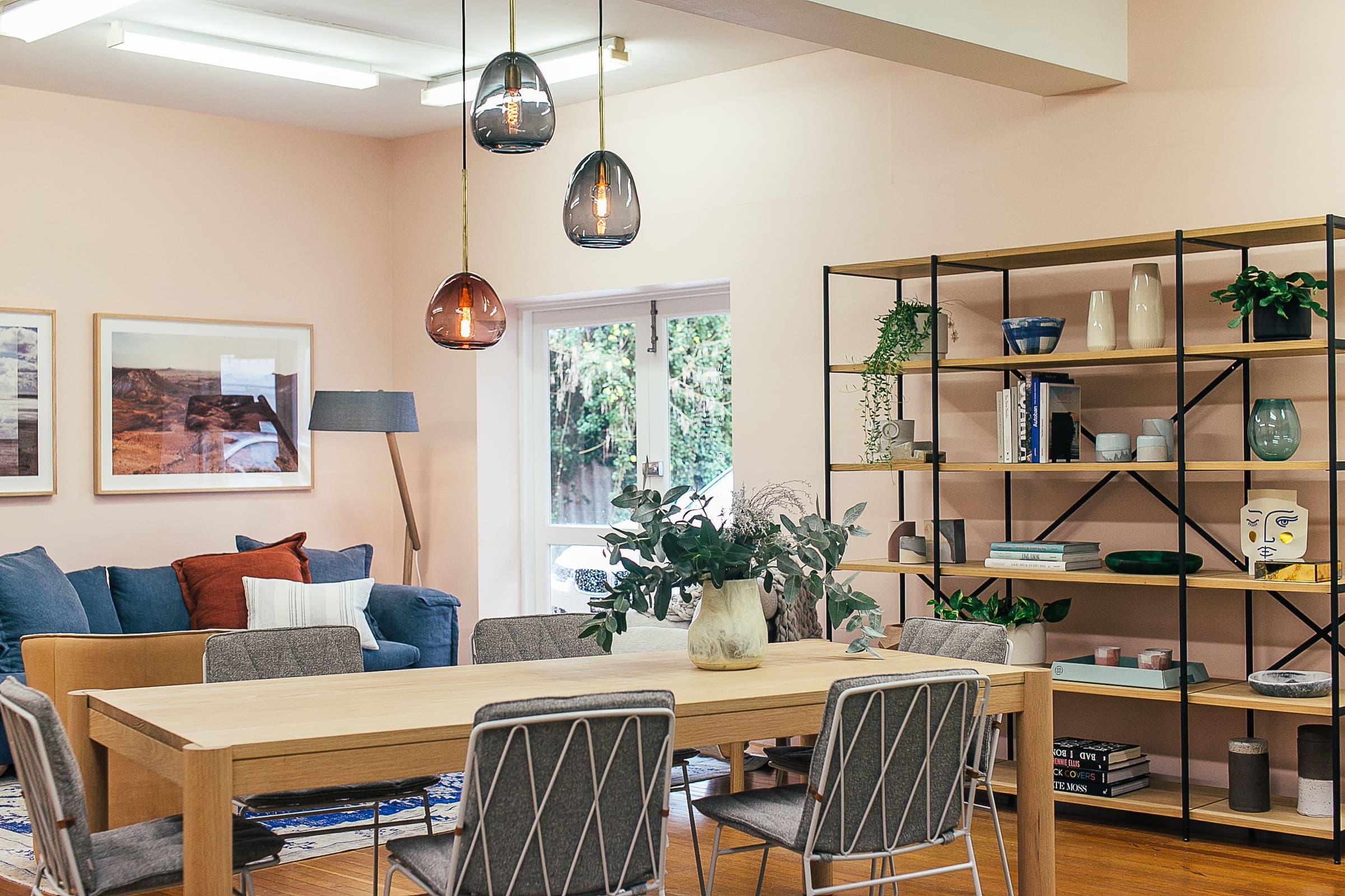 A bright living and dining space photographed with natural light for a property listing